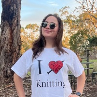 Picture of Nina wearing a shirt saying 'I love knitting'